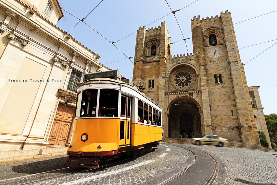 lisbon_cathedral__yellow_tram_lisbon_portugal_freebirdtour